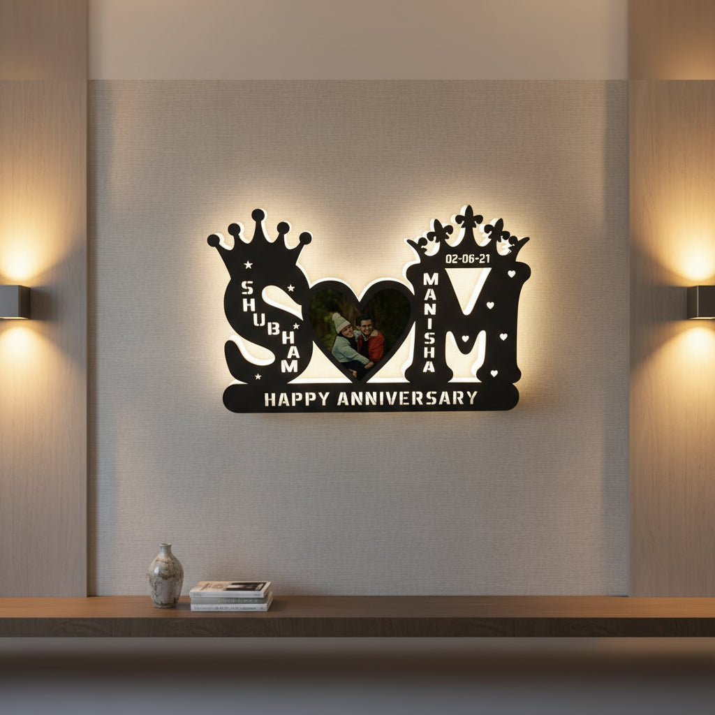 Decorative wall art with names 'Shubham' and 'Manisha', date '02-06-21', and 'Happy Anniversary' text.