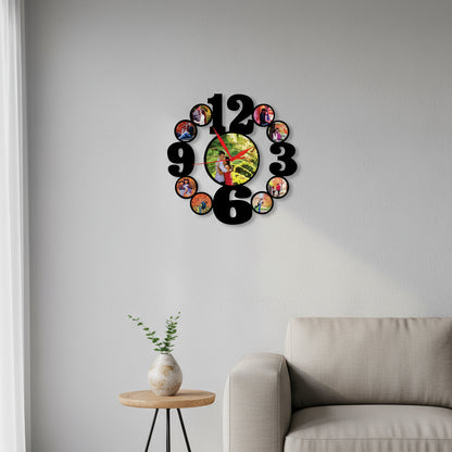 Wall clock with circular cutouts for photos, showing a couple in each, on a white background.