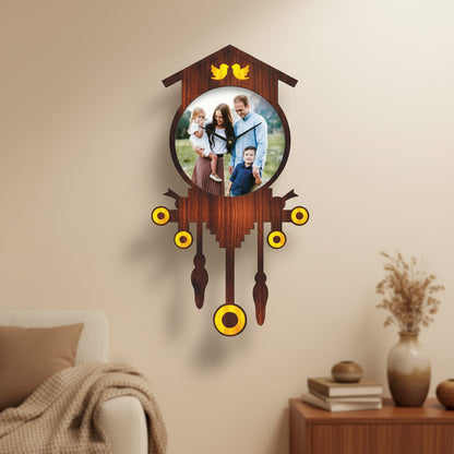 Wooden cuckoo clock with a family photo in the center on a white background