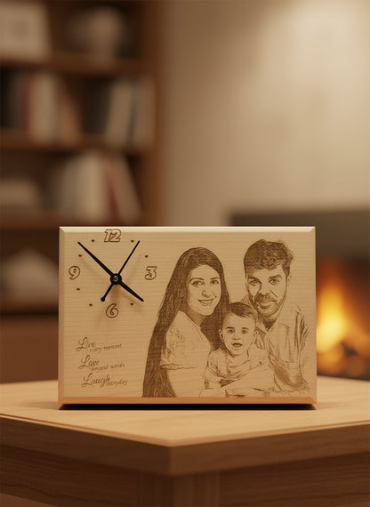 Wooden clock with family engraving and decorative items in the background